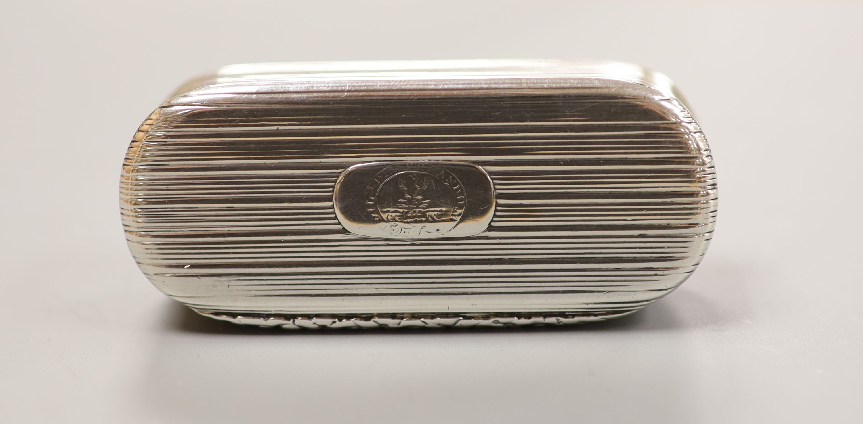 A George IV reeded silver oval snuff box, by Joseph Taylor, Birmingham, 1826, 78mm.